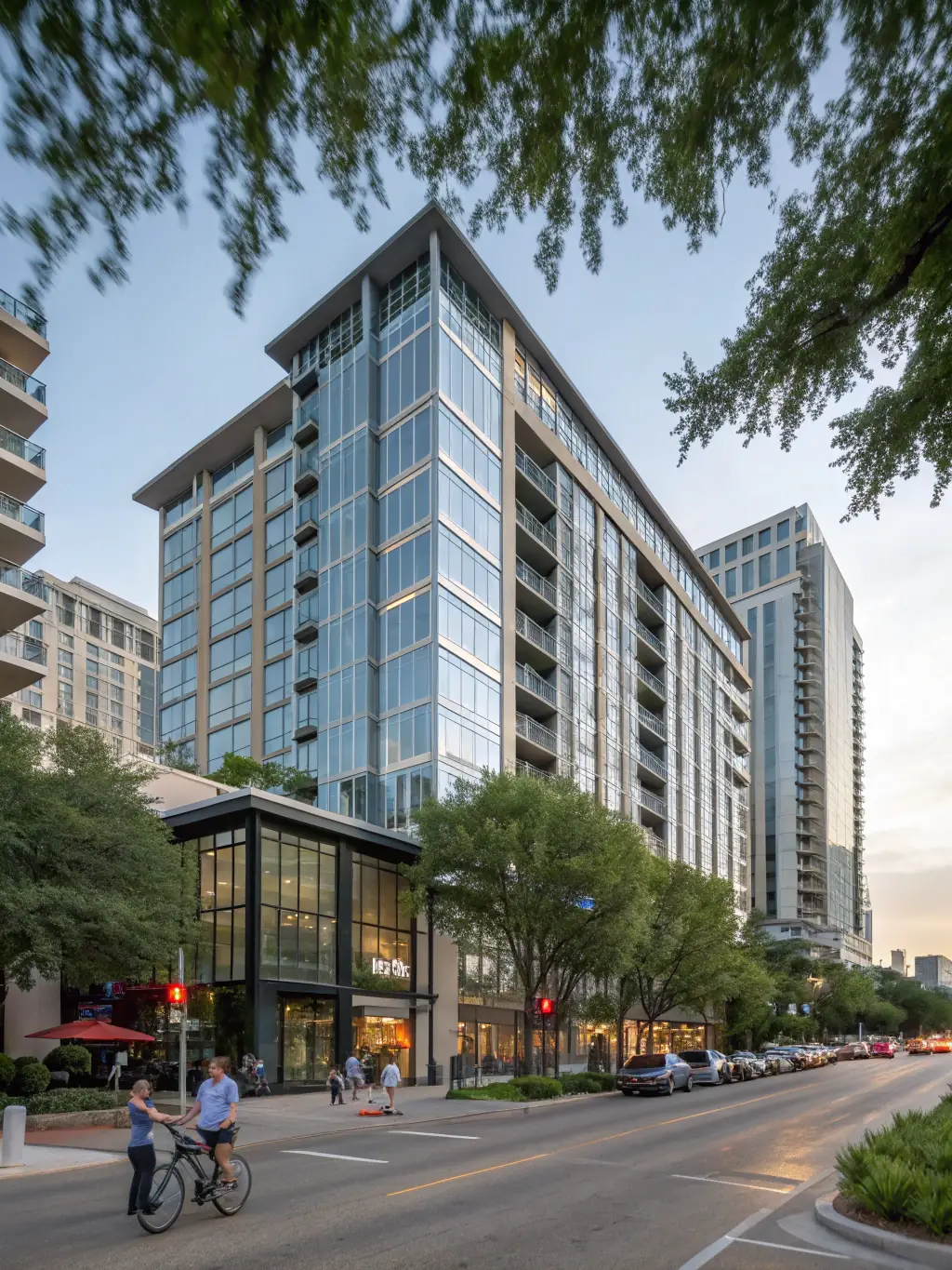 A high-rise apartment building in downtown Austin, Texas, with modern architecture and a vibrant cityscape in the background, representing CorpHaven's corporate housing options in Austin.